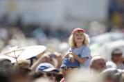 A child watches as Pope Francis leads the Angelus from the window of his studio overlooking St. Peter's Square at the Vatican Aug. 30. (CNS photo/Max Rossi, Reuters)