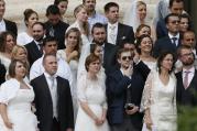 Newly married couples watch as Pope Francis leads his general audience in St. Peter's Square at the Vatican Sept. 10. (CNS photo/Paul Haring)