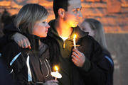 A couple attends a candlelight vigil at the Columbine Memorial in Clement Park in Littleton, Colo., April 19, 2009, the eve of the 10th anniversary of tragic shootings at Columbine High School. (CNS photo/James Baca, Denver Catholic Register) 