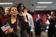 Immigrant Isabel Rivera from the Dominican Republic takes the oath of citizenship during a naturalization ceremony in New York. (CNS photo/Brendan McDermid, Reuters) 