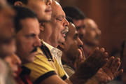 Christians pray during Coptic Orthodox Easter liturgy at main cathedral in Cairo.