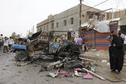 Residents gather at site of deadly car bomb attack in Baghdad, May 20 (CNS pho to/Mohammed Ameen, Reuters)