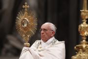 Pope Francis leads the Benediction following eucharistic adoration in St. Peter's Basilica at the Vatican June 2. Catholics gathered at the same time for eucharistic adoration in cathedrals and parishes around the world for the first Vatican-organized global holy hour. (CNS photo/Paul Haring)