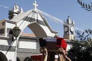 Mourners carry coffins of Christian men killed during raid in Syria (CNS photo/Khaled al-Hariri, Reuters)