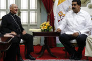 Venezuela's President Maduro talks with Archbishop Padron during meeting in Caracas.