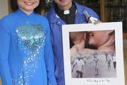 Jesuit Father Tan Pham, parochial vicar at Transfiguration Church in Marietta, Ga., poses with Vietnam War survivor Kim Phuc Phan Thi. (CNS photo/Michael Alexander, Georgia Bulletin) 