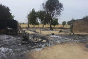 Soldiers stand guard following an attack in Nigeria. (CNS photo/Reuters)