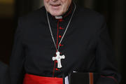 Cardinal Pell of Sydney leaves meeting of cardinals with Pope Francis in synod hall at Vatican. (CNS photo/Paul Haring)