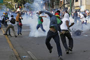 Demonstrators confront police during protests in Venezuela.