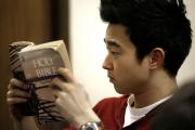 Andy Park looks up a Scripture passage during a 2010 Bible study at the University of Illinois at Chicago. (CNS photo/Karen Callaway, Catholic New World) 