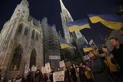 Members of Vienna's Ukrainian community protest outside St. Stephen's Cathedral. (CNS photo/Leonhard Foeger, Reuters)