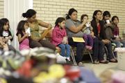 Migrants sit in shelter at Catholic church in Texas. 