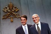 Jean-Baptise de Franssu, new president of Vatican bank, and outgoing president Ernst Von Freyberg pose during news conference. (CNS photo/Tony Gentile, Reuters)