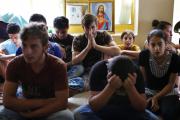 Displaced Iraqi Christians who fled from Islamic State militants pray at school acting as refugee camp in Irbil. (CNS photo/Ahmed Jadallah, Reuters)