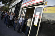People enter a government-run employment office in Madrid.