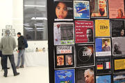 No-nukes forum participants talk at Vienna event with image of Pope Francis posted in background.