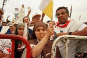 A nun waves a Vatican flag while attending Mass with Pope John Paul II in Havana Jan. 25, 1998.