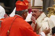 Pope Francis greets new Cardinal Soane Mafi of Tonga during the February 2015 consistory at St. Peter's Basilica at the Vatican. (CNS photo/Paul Haring)