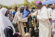 Nigerian archbishop presents relief material to internally displaced people in Jos, Nigeria