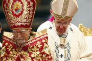 Pope Francis looks on after greeting Armenian Catholic Patriarch Nerses Bedros XIX Tarmouni during Mass marking 100th anniversary of Armenian genocide