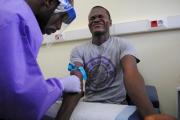 The blood of a survivor of the Ebola virus is extracted as part of a study launched at Liberia's John F. Kennedy Hospital in Monrovia in June 2015. (CNS photo/Reuters)