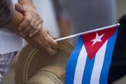Woman holds Cuban flag near Havana's apostolic nunciature Sept. 19. (CNS photo/Tyler Orsburn)