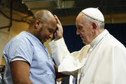 Pope Francis blesses a prisoner as he visits the Curran-Fromhold Correctional Facility in Philadelphia in September 2015. (CNS photo/Paul Haring)