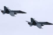 In this May 31, 2014, file photo, two Royal Canadian Air Force F-18 Hornet jets fly over Romania. Canada's new government has decided to stop airstrikes against Islamic State in the Middle East. (CNS photo/Mircea Rosca, EPA)