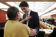 Prime Minister Justin Trudeau of Canada greets a woman upon the release of the Truth and Reconciliation Commission's final report in Ottawa in 2015. (CNS photo/Chris Wattie, Reuters)