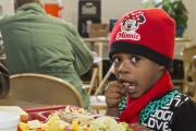 A young girl eats supper at the North End Soup Kitchen in Flint, Mich., Feb. 18. The soup kitchen is operated by Catholic Charities. (CNS photo/Jim West) 