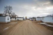 Homes line a dirt road in 2014 on the Rosebud Reservation in south central South Dakota. Poverty and addiction are major contributing factors to the high suicide rate on the Lakota reservation. (CNS photo/Ron Wu, Catholic Extension) 