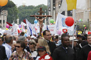 A large crucifix is seen as people participate in the 6th annual March for Life in Rome May 8. The march ended outside St. Peter's Square at the Vatican where Pope Francis was leading the Regina Coeli. (CNS photo/Paul Haring) 