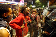 A man confronts riot police during Sept. 21 protests in Charlotte, N.C., after police fatally shot Keith Lamont Scott in the parking lot of an apartment complex. (CNS photo/Jason Miczek, Reuters)