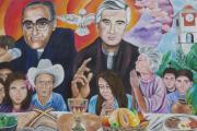 A mural in El Paisnal, El Salvador, seen in this Jan. 29 photo, features Blessed Oscar Romero and town native Father Rutilio Grande, surrounded by rural men, women and children, the community the Jesuit Father Grande served from 1972 until his March 12, 1977, assassination. (CNS photo/Rhina Guidos)