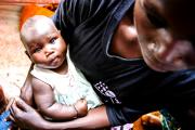 A mother cradles her baby May 30 at the Bidi Bidi refugee camp in Arua, Uganda, where thousands from war-ravaged South Sudan have fled in search of shelter and safety. (CNS photo/Helen Manson, U.S. Embassy in Uganda) 