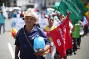 Protesters in San Salvador, El Salvador, demand that lawmakers provide water access to the poor in this July 2017 photo. (CNS photo/Jose Cabezas, Reuters)