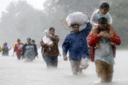 Residents wade through floodwaters from Tropical Storm Harvey Aug. 28 in Beaumont Place, Texas. (CNS photo/Jonathan Bachman, Reuters) 