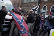 People struggle with a Confederate flag as a crowd of white nationalists are met by a group of counter-protesters in early August in Charlottesville, Va. (CNS photo/Justin Ide, Reuters)