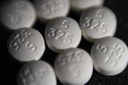 Pills of the opioid oxycodone-acetaminophen, also known as Percocet. (AP Photo/Patrick Sison)