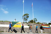 Venezuelan migrants walk across the border from Venezuela into the Brazilian city of Pacaraima. (CNS photo/Nacho Doce)