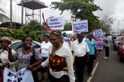 Nigerians carry placards during a May 22 protest in Lagos against the killing of innocent citizens, presumably by herdsmen, in some parts of the country. Catholics marched in various cities around the country. (CNS photo/Peter Dada)