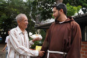 Capuchin Friar Luis Antonio Salazar greets a man in Caracas, Venezuela, who received a free meal at the Our Lady of Chiquinquira Parish on Oct. 12, 2019. Every Saturday the parish organizes free meals for hundreds of needy people. (CNS photo/Manuel Rueda)