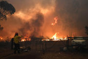 Rural Fire Service crews engage in property protection during wildfires along the Old Hume Highway near the town of Tahmoor, Australia, outside Sydney, Dec. 19, 2019. Wildfires have been burning since August and have destroyed an area comparable to the combined region of the Netherlands and Belgium. (CNS photo/Dean Lewins, AAP via Reuters)