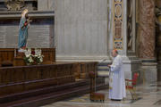 Cardinal Angelo Comastri, archpriest of St. Peter’s Basilica, leads a Marian prayer service in the basilica at the Vatican on March 11. In attendance were some Vatican employees seated one meter apart as a precaution against the coronavirus. (CNS photo/Vatican Media) 