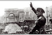 Benito Mussolini waves to the crowds in Rome in the 1930s (photo: Shawshots/Alamy).