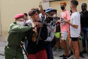 Police detain a person during protests in Havana July 11, 2021. Thousands of Cubans took to the streets to protest a lack of food and medicine as the country undergoes a grave economic crisis aggravated by the Covid-19 pandemic and U.S. sanctions. (CNS Photo/Reuters)