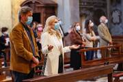 A limited number of faithful attend an Easter Mass in the San Lorenzo in Lucina church in Rome, April 4, 2021.