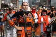 Indigenous performer Danielle Migwans attends a march on Canada Day in Toronto on July 1, 2021, after the discovery of hundreds of unmarked graves on the grounds of two former residential schools for Indigenous children in Canada. More than two dozen Indigenous delegates, accompanied by a handful of Canadian bishops, plan to meet with Pope Francis at the Vatican March 28-April 1. (CNS photo/Carlos Osorio, Reuters)