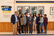 Timothy L. Porter, who in 1964 became the second African American to graduate from Loyola Blakefield, is picture with his family at the schools “Black, Blue and Gold” exhibit, which commemorates Black alumni (photo: Donovan Eaton).