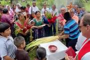 After a 12-hour journey from Belize City, Jesuit Father Sam Wilson begins Palm Sunday Mass with the people of Machakilha, deep in Mayan territory along the Belize border with Guatemala. Screen grab from video taken by Jeremy Zipple, S.J.